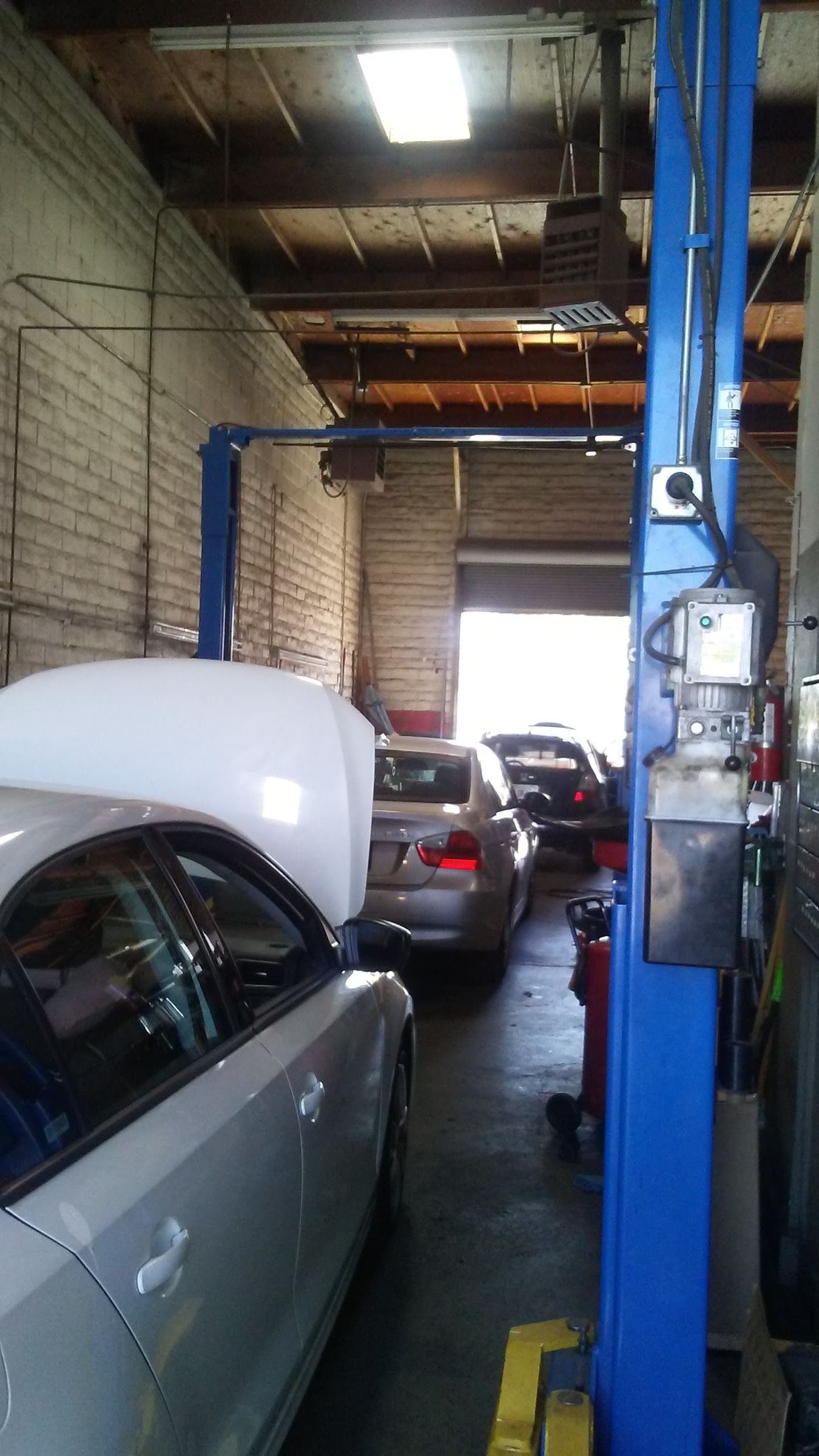 Car on the lift in the service bay
